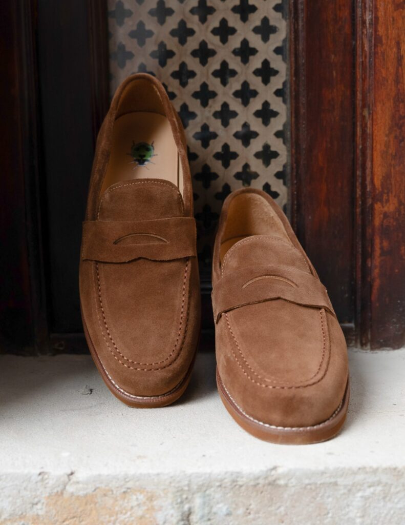 Naked Emperor oxford loafer mens shoes displayed in artistic editorial setting